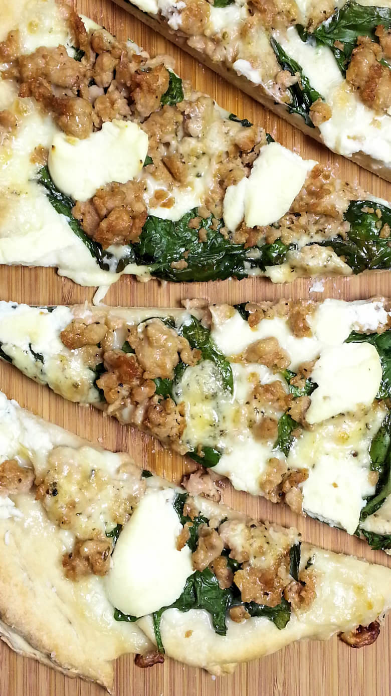 Close up picture of White Spinach and Three Cheese Pizza